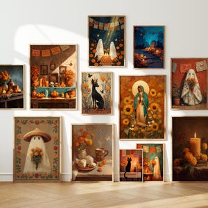 May include: A collection of framed art prints featuring Day of the Dead themes. The artwork includes images of ghosts, candles, altars, and a black dog, all in warm, earthy tones. The prints are displayed on a white wall above a wooden floor.
