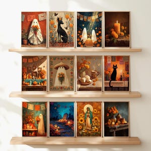 May include: A collection of framed art prints featuring Day of the Dead themes. The artwork includes images of ghosts, black cats, candles, and floral arrangements, all set against a warm, autumnal color palette. The prints are displayed on wooden shelves.