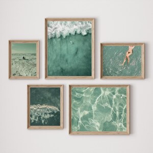 Set of 10 sage green ocean digital prints featuring tiny people swimming, aerial surfers, beach waves, and surfboard wall art. This beachy wall art collection brings a calm, coastal vibe to any space. Perfect for sage green wall art themes, surf-inspired decor, tiny people art collectors, and summer homes. Includes aerial beach prints, surfer wall art, and ocean photography designed for minimalist, coastal, and sage green interiors.