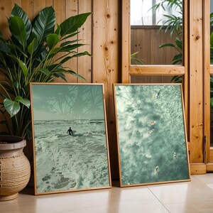Set of 10 sage green ocean digital prints featuring tiny people swimming, aerial surfers, beach waves, and surfboard wall art. This beachy wall art collection brings a calm, coastal vibe to any space. Perfect for sage green wall art themes, surf-inspired decor, tiny people art collectors, and summer homes. Includes aerial beach prints, surfer wall art, and ocean photography designed for minimalist, coastal, and sage green interiors.