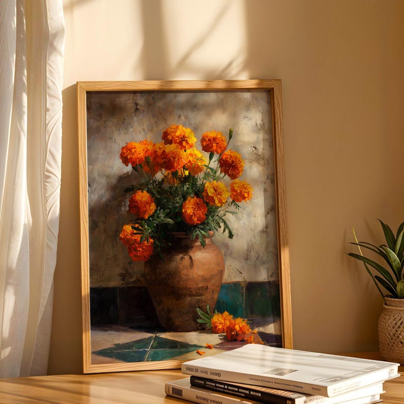 May include: A framed still life painting featuring a terracotta vase filled with vibrant orange and yellow marigold flowers. The painting has a rustic aesthetic, with a neutral background and a wooden frame. A few flowers are scattered on the floor.