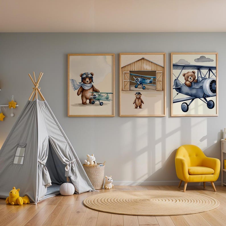 Set of 3 digital nursery prints featuring an aviator bear, vintage biplanes, and cozy airplane hangar scenes. Perfect for an aviator nursery, airplane nursery, baby boy travel room, pilot baby room, vintage nursery decor, and adventure-themed baby rooms. Ideal wall art for baby showers, nursery wall displays, and cozy baby room corners. Soft neutral colors with a classic vintage aviation theme.