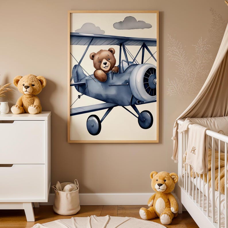 Set of 3 digital nursery prints featuring an aviator bear, vintage biplanes, and cozy airplane hangar scenes. Perfect for an aviator nursery, airplane nursery, baby boy travel room, pilot baby room, vintage nursery decor, and adventure-themed baby rooms. Ideal wall art for baby showers, nursery wall displays, and cozy baby room corners. Soft neutral colors with a classic vintage aviation theme.