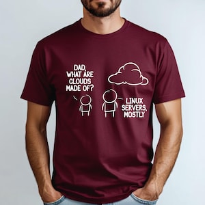 May include: A maroon t-shirt with a white graphic of a cartoon conversation between a child and an adult. The child asks "Dad, what are clouds made of?" and the adult points to a cloud and says "Linux servers, mostly."