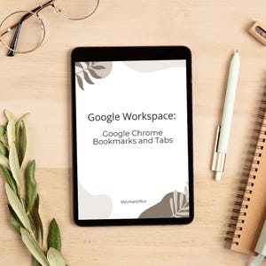 May include: A black tablet displays a white document titled "Google Workspace: Google Chrome Bookmarks and Tabs." The tablet is surrounded by a pen, glasses, a notebook, and greenery on a light wood surface.