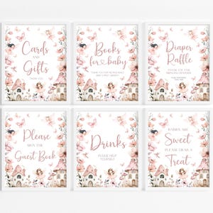 May include: Six printable signs for a baby shower with a fairy theme. The signs are decorated with pink flowers, butterflies, and fairies. The signs say "Cards and Gifts", "Books for Baby", "Diaper Raffle", "Please Sign the Guest Book", "Drinks", and "Babies are Sweet, Please Grab a Treat".