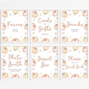 Peut inclure: Six panneaux encadrés avec des bordures blanches, présentant des citrouilles et des feuilles d'automne à l'aquarelle. Les panneaux affichent du texte tel que "Favors", "Cards and Gifts", "Drinks", "Photo Booth", "Dessert Bar" et "Guest Book".