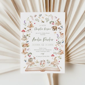 May include: A baby shower invitation with a watercolor illustration. The invitation features the text "A New Chapter Begins" and details for Amelia Parker's baby shower. The design includes woodland animals, flowers, and an open book.
