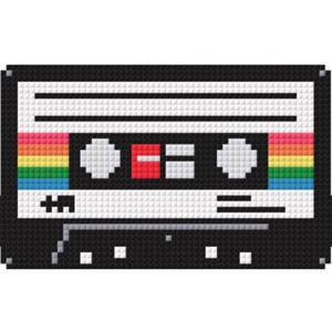 May include: Pixelated cassette tape design with a rainbow stripe and black border. The tape features white and black details, including the play and stop buttons. The design is reminiscent of 1980s music culture.