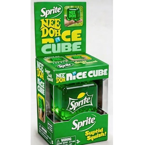 May include: A green Sprite Nee Doh Nice Cube squishy toy packaged in a branded cardboard box. The box features the Sprite logo, the text Nee Doh Nice Cube, and Suptid Squish. The toy is a translucent green cube with the Sprite logo on the front.