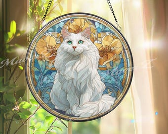 May include: Round stained glass window art featuring a white cat with green eyes. The cat is centered in a design with yellow flowers and blue accents. The window is framed in black and hangs from a chain.