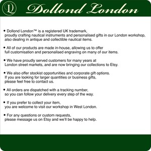 May include: A white informational sign with a dark green header featuring the text Dollond London and a logo. The text details a UK trademark for nautical instruments, personalized gifts, antique items, customization, and contact information.