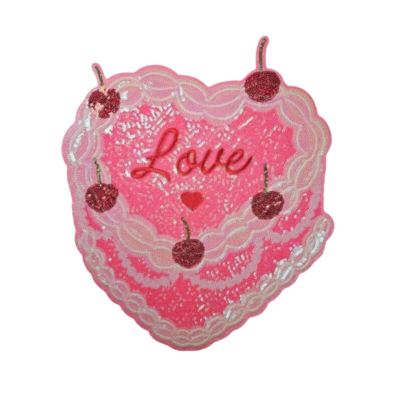 May include: A heart-shaped sequined patch in shades of pink, adorned with the word "Love" and small red cherries. The patch has a layered design with a scalloped edge, perfect for adding a touch of sparkle to clothing or accessories.