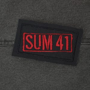 May include: Black and red embroidered patch with the text "SUM 41" in red.