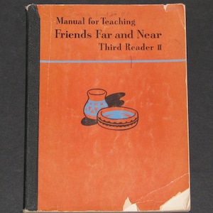 May include: An orange book cover with the title "Manual for Teaching Friends Far and Near Third Reader II". The cover features a simple illustration of two pottery items, one a vase and the other a bowl.