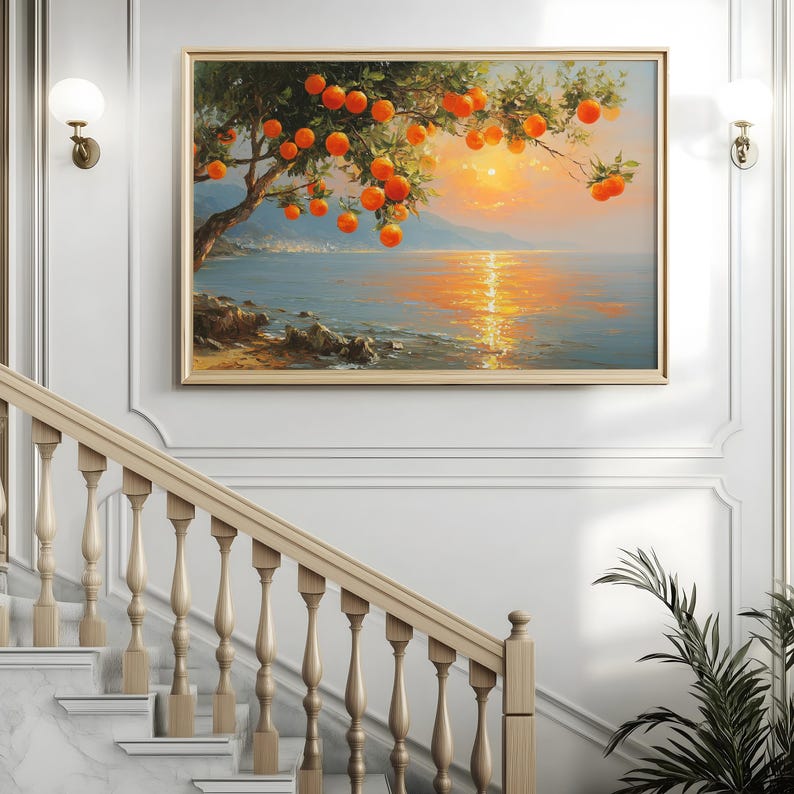 May include: A framed landscape painting depicts an orange tree laden with fruit, overlooking a tranquil sea at sunset. The artwork features a golden frame and is displayed above a staircase with a wooden banister.