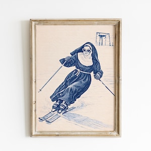 Peut inclure: Impression encadrée d'une religieuse skiant, réalisée à l'encre bleue sur fond beige. La religieuse porte des lunettes de soleil et un habit, et skie. Un télésiège est visible en arrière-plan. L'œuvre est dans un cadre en bois rustique.
