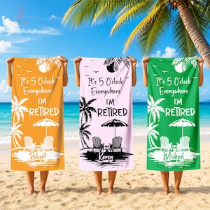 May include: Three rectangular beach towels in orange, light pink, and green, each featuring a white graphic of palm trees, two chairs, and an umbrella. The text reads "It's 5 O'clock Everywhere I'M RETIRED" with the names Robert, Karen, or Michael.