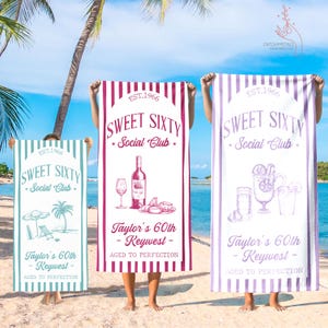 May include: Three beach towels with the text "Sweet Sixty Social Club" and "Taylor's 60th - Keywest - Aged to Perfection." The towels are in teal, red, and purple with vertical stripes and illustrations of drinks and beach scenes.