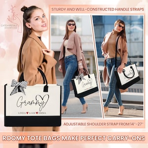 May include: Cream-colored tote bag with black accents, featuring the word "Grammy" in script, a heart, and names. The bag has sturdy handles and a black and white bow. Adjustable shoulder strap from 14"-27".