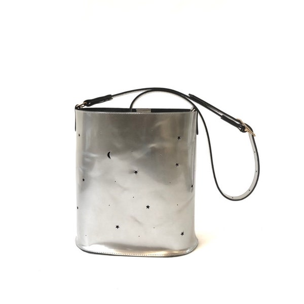 Leather bucket bag silver metallic with punched stars and moon.