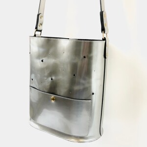 Leather bucket bag silver metallic with punched stars and moon. image 2