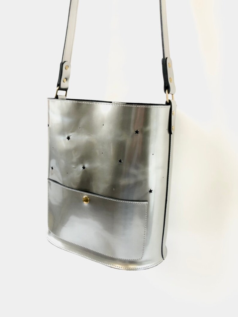 Leather bucket bag silver metallic with punched stars and moon. image 2