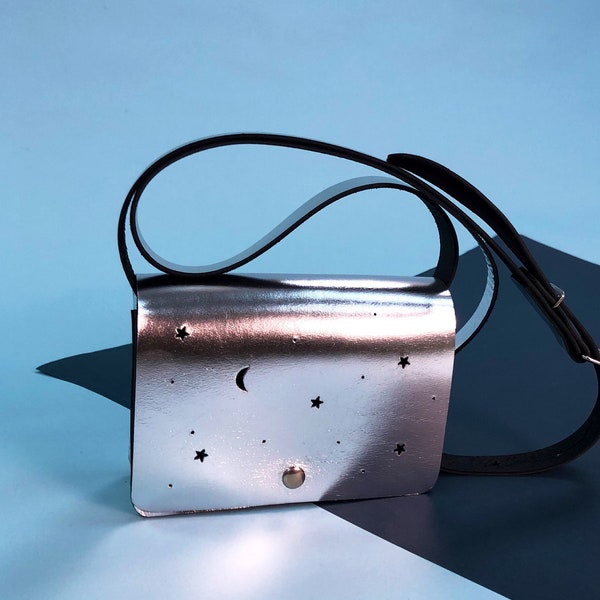 Leather purse in silver metallic with punched stars and moon