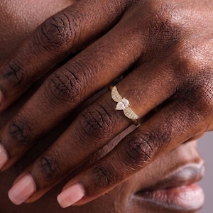gold wing ring
simple promise ring
guardian angel ring
protection ring
angel wings ring
diamond angel ring
gold angel ring
tiny diamond ring
wedding ring
diamond wing ring
angel ring
angel wing ring
self-reminder gift