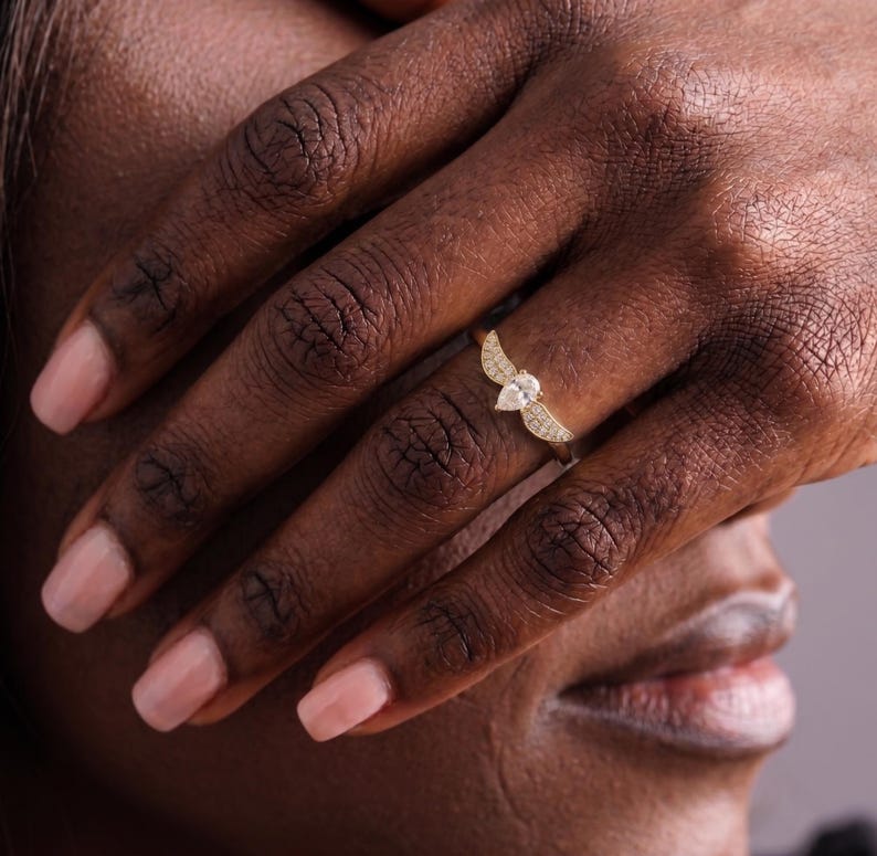 gold wing ring
simple promise ring
guardian angel ring
protection ring
angel wings ring
diamond angel ring
gold angel ring
tiny diamond ring
wedding ring
diamond wing ring
angel ring
angel wing ring
self-reminder gift