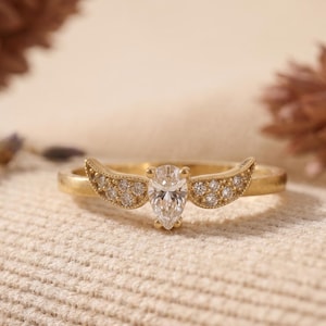 gold wing ring
simple promise ring
guardian angel ring
protection ring
angel wings ring
diamond angel ring
gold angel ring
tiny diamond ring
wedding ring
diamond wing ring
angel ring
angel wing ring
self-reminder gift