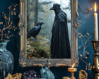 May include: A decorative gold framed mirror with a forest scene featuring two ravens. One raven is perched on a rock, the other is wearing a crown and cloak. A lit candle, crystals, and tarot cards are on the table in front of the mirror.