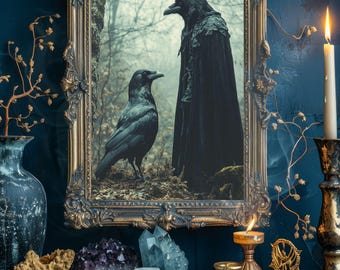 May include: A framed artwork featuring two ravens, one wearing a crown and cloak. The ornate gold frame surrounds the image, which is set against a dark blue wall. A lit candle, crystals, and tarot cards are on a wooden surface.