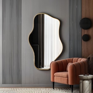 adding elegance to any living room, Asymmetrical modern hanging mirrors with unique artistic designs enhance contemporary home decor