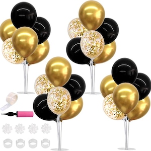 May include: A collection of black, gold, and confetti-filled balloons arranged on white stands. The balloons are in clusters, creating a festive display. A pink hand pump and balloon accessories are also included.