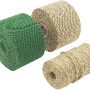 May include: Three rolls of decorative burlap ribbon and twine. One roll is green, the other is natural tan, and the third is a spool of natural twine. The burlap ribbon has a woven texture, and the twine is tightly wound.