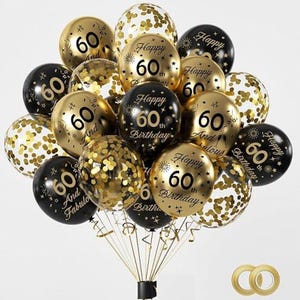 May include: A festive balloon bouquet for a 60th birthday celebration. The balloons are in gold, black, and white, with confetti and the words "Happy 60th Birthday" and "And Fabulous" printed on them. Ribbons and a gold ring are also included.