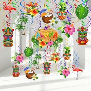 May include: A set of colorful Hawaiian themed party decorations with hanging swirls, palm trees, pineapples, flowers, and tiki masks. The decorations say "Aloha" on a sign.