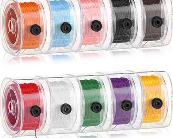 May include: A set of colorful spools of thread in clear plastic containers. The thread colors include orange, blue, pink, black, brown, red, white, green, purple, and yellow. Each spool has a black center and is neatly wound.