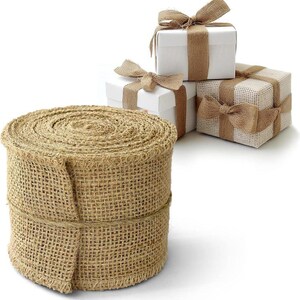 May include: A roll of natural burlap ribbon, perfect for adding a rustic touch to crafts, gifts, and home decor. The ribbon is made of natural jute fibers and has a rough, textured surface.