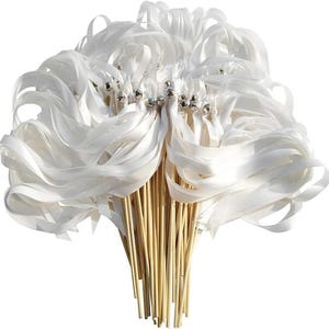 May include: A bundle of white satin ribbon wands. Each wand has a silver bell attached to the top of the wooden dowel. The ribbons are long and flowing, creating a whimsical and elegant look. Perfect for weddings or celebrations.