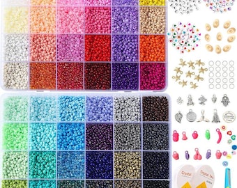 May include: A craft kit with a variety of colorful beads, including pink, purple, yellow, and brown, organized in a clear plastic container. Additional components include letter beads, charms, jump rings, and beading tools. A pair of blue scissors is also included.