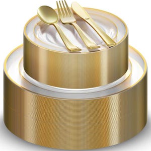 May include: A stack of gold-colored disposable plates with a white rim, topped with gold-colored silverware: a spoon, fork, and knife. The plates and utensils are arranged for a formal dining setting.