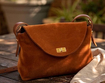 Genuine Suede Handbag with Lock Closure and Extra Strap