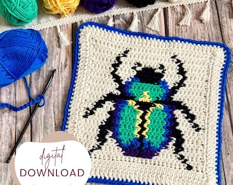 May include: A square, cream-colored crochet piece with a blue border features a colorful beetle design in shades of teal, green, yellow, and purple. The words "digital download (PDF pattern)" are displayed. Various balls of yarn and a crochet hook are also visible.
