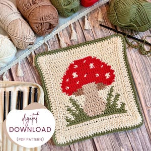 May include: A crocheted square with a red mushroom design, white spots, and green grass. The square is bordered in green and cream. The image includes yarn balls in various colors and the text "digital download (PDF pattern)".