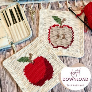 May include: Two square, off-white crochet potholders with red apple designs and green leaves. The image also shows a crochet hook set, scissors, and a ball of red yarn. The text "digital DOWNLOAD (PDF PATTERN)" is visible.