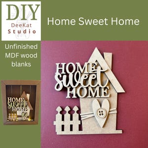 May include: An unfinished MDF wood cutout featuring the text Home Sweet Home in a layered script and block font. The design includes a house silhouette, a picket fence, and a heart shape adorned with a small four-hole button at the center.