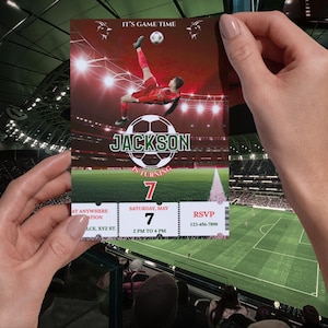May include: A football-themed invitation card showing a player kicking a ball. The card has the text "IT'S GAME TIME" at the top, with the name "JACKSON" and the number "7" displayed. Includes event details.