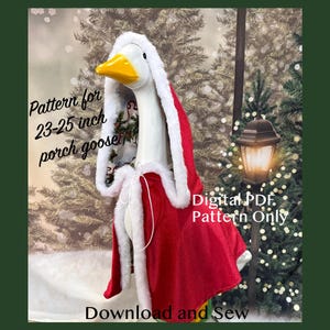 May include: A red cape with white faux fur trim designed for a 23-25 inch porch goose. The text on the image reads: Pattern for 23-25 inch porch goose, Digital PDF. Pattern Only, Download and Sew. The cape features a hood and white ties.